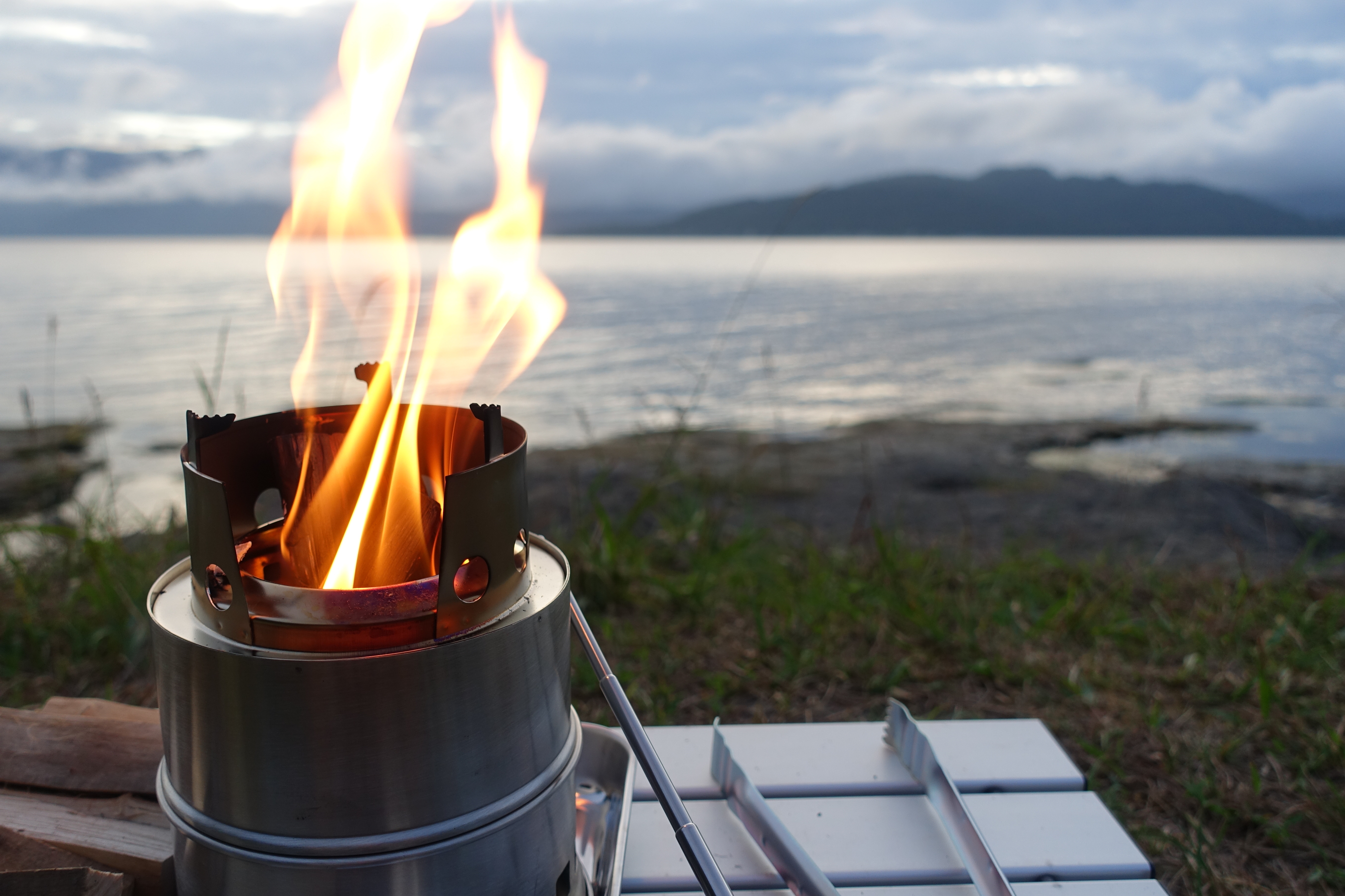 Solo Stove sitting on a table overlooking a lake